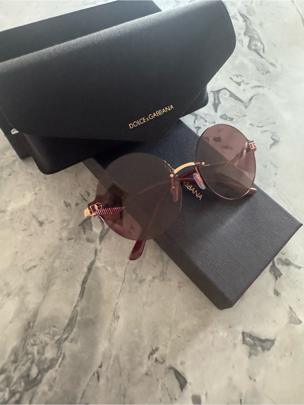Dolce & Gabbana Round Rimless Sunglasses in Burgundy with Gold Accents